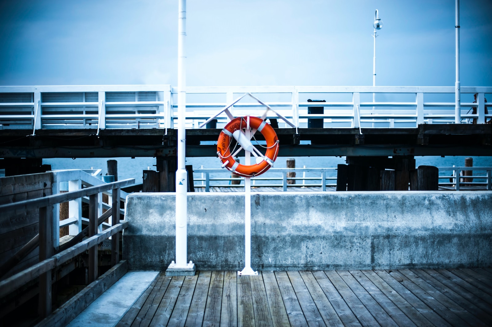 a life preserver hanging on a metal pole
